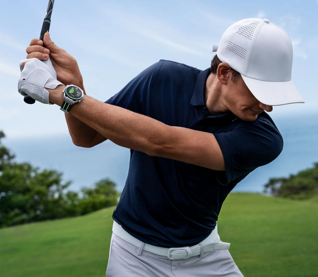 Huawei Watch Ultimate worn by golfer mid-swing on course